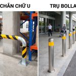 Rào chắn chữ U sơn vàng đen bắt bản mã trước chân cột cạnh kệ hàng và xe nâng trong kho, bên cạnh hàng trụ bollard inox dán phản quang trước sảnh tòa nhà có người đẩy xe lăn đi qua